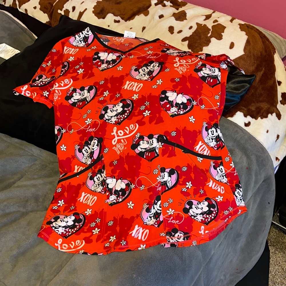small red scrub top